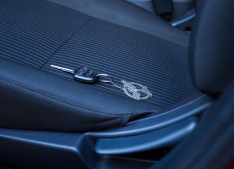 Keys resting in the back seat of a car